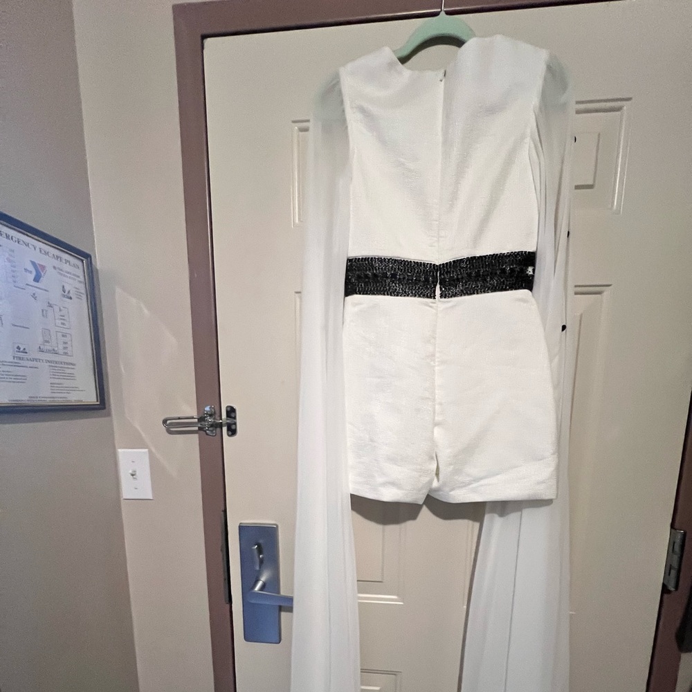 White Jumper with long elegant sleeve. Great for pageant rehearsal